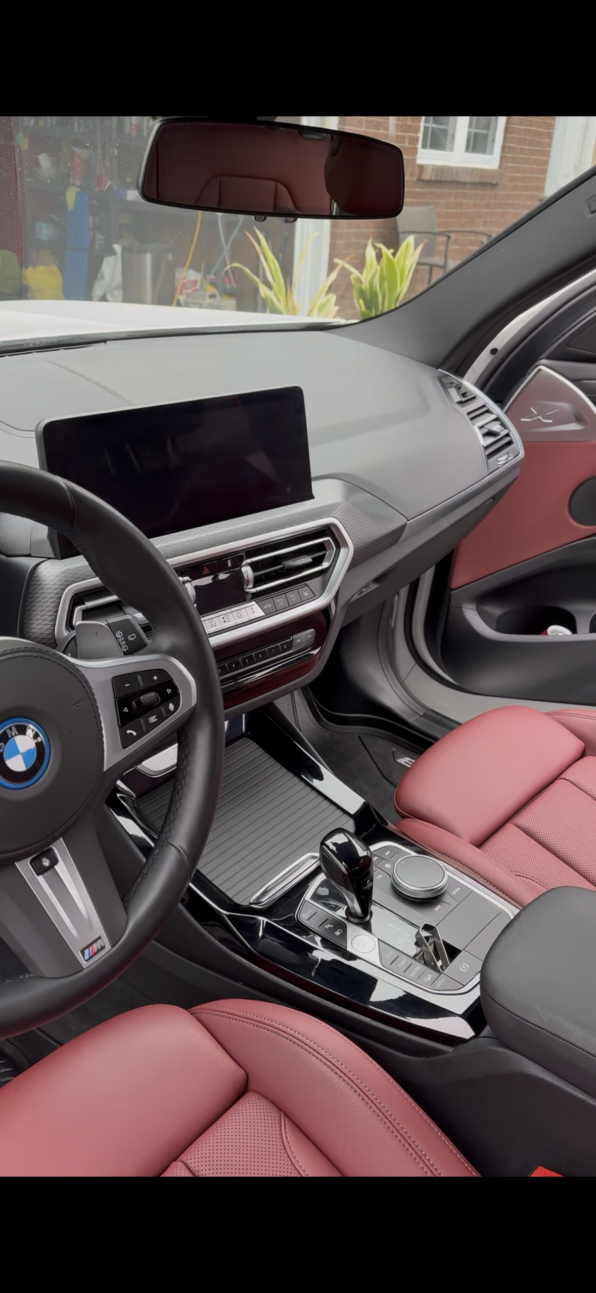 BMW steering wheel and red leather interior
